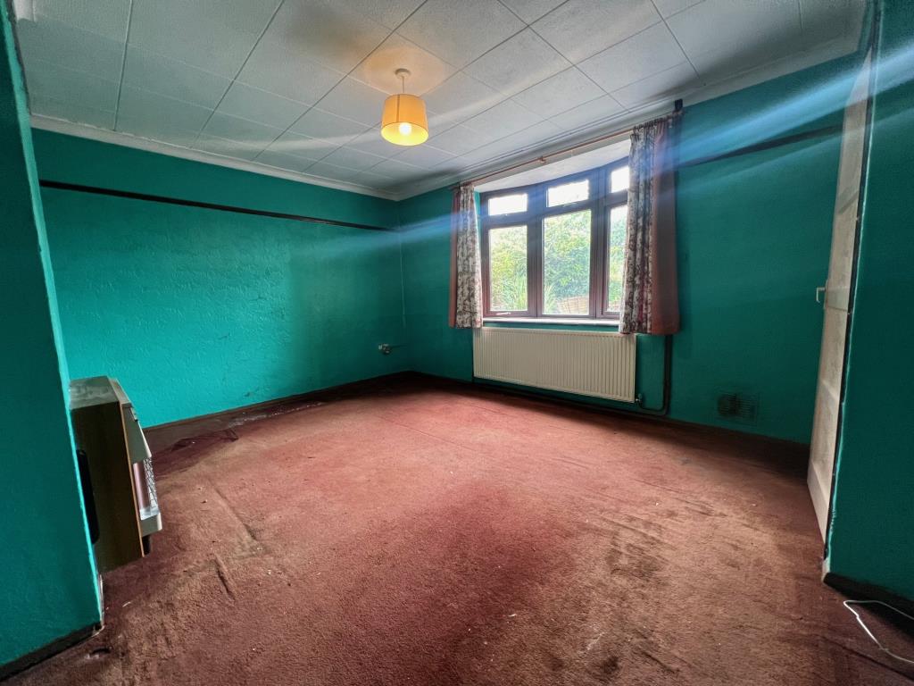 Lot: 13 - TWO-BEDROOM SEMI-DETACHED HOUSE - Living room with window to front, radiator and gas fire
